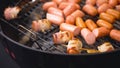 Sausages wrapped in bacon fried on the tray. Sausages wrapped in bacon barbecue Royalty Free Stock Photo