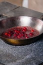 cherry sauce for poultry in a pan