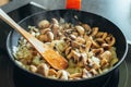 Sauteed mushrooms with onions in the pan