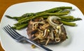 Sauteed onions and mushrooms cover a steak