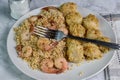 sauteed shrimp and rice served with scallops