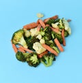 Sauteed vegetables on a blue background