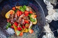 Sauteed vegetables with roast beef in dark plate top view. Healthy food, dieting. warm salad with copy space