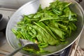 Sauteing Japanese spinach