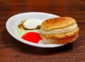 Sauth asian food chicken bun kabab With Tomato Sauce and Spicy Chutney in white plate isolated on dark wooden table famous