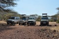 Savana landscape with safari jeeps