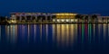 Savannah Convention Center lighting reflects on the Savannah River during blue hour