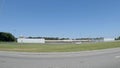 POV driving street pan International Decor retail strip mall closed abandoned seen from interstate 95