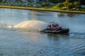 Tugboat Water Salute in Early Morning