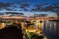 Savannah Georgia skyline at sunset from the top of a roof deck with the river water, bridge and buildings Royalty Free Stock Photo