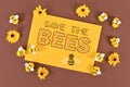 Save the Bees sign surrounded by felt bees and flowers