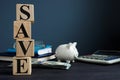 Save from cubes and piggy bank. Money savings concept.