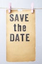 Save the date, stamped words on vintage yellowed paper page