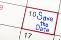 Save the Date written on a calendar