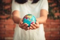 Save The Earth and Care Environment Concept, Close-up Portrait of Woman is Holding Mockup Global in Her Hands on Tree Leave Royalty Free Stock Photo