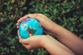 Save The Earth and Care Environment Concept, Close-up Portrait of Woman is Holding Mockup Global in Her Hands on Tree Leave Royalty Free Stock Photo