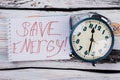 Save enegry tagline and alarm clock. Royalty Free Stock Photo