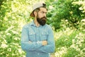 Save environment. Eco activist. Man handsome bearded guy in sunny forest. United with environment. Go green think fresh Royalty Free Stock Photo