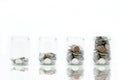 Save money concept with coin in bottle stack growing on white background Royalty Free Stock Photo