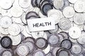Save money concept, tag health above algeria coin