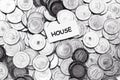 Save money concept, tag house above algeria coin