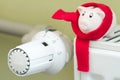 Save money heating concept with thermostat and piggy bank