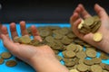 Save money for retirement and account banking for finance concept, Man hand with coin money on business office table vintage style Royalty Free Stock Photo