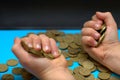 Save money for retirement and account banking for finance concept, Man hand with coin money on business office table vintage style Royalty Free Stock Photo