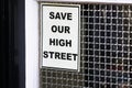 Save our high street sign on closed shop window due to online shopping and recession in the uk Royalty Free Stock Photo