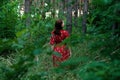 Save and Plant Trees, Save Earth and Nature, Stand For Trees, Save Forests and Heal the Climate. Woman in a red dress