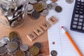 `Save` spelled out in wooden letter tiles