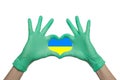 Save Ukraine. Doctor hands in green medical gloves showing heart isolated on white background Royalty Free Stock Photo