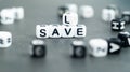 Save versus sale words in white letter block beads. Shopping and smart consumption concept