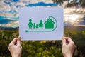 Save world ecology concept environmental conservation with hands holding cut out paper earth loving ecology family showing Royalty Free Stock Photo