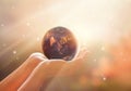 Save the world energy campaign.Planet earth on human hands show Royalty Free Stock Photo