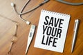 Save Your life words on the white paper and pen Royalty Free Stock Photo