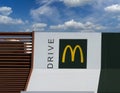 McDrive sign on new McDonalds restaurant on blue sky cloudy