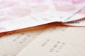 Saving account passbook and renminbi Royalty Free Stock Photo