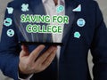 SAVING FOR COLLEGE phrase on the screen. Auditor use internet technologies at office. Concept search and SAVING FOR COLLEGE Royalty Free Stock Photo