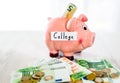 Saving concept. Piggy bank with an inscription college