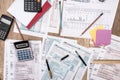 tax form, budget, notepad, pen, calculator