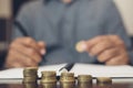 Saving money. businessman hand putting stack coins to show Royalty Free Stock Photo