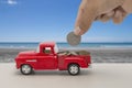 Saving money for car for cash, finance concept with tropical sea and beach background Royalty Free Stock Photo