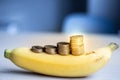 Money coins stack growing business on banana,Saving money concept