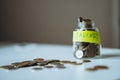 saving money concept. glass jar full of coins. Image with selective focus Royalty Free Stock Photo