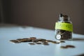saving money concept. glass jar full of coins. Image with selective focus Royalty Free Stock Photo