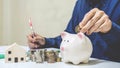 Saving money concept Man hand putting coin drop into piggy bank and write Finance. save money concept, concept Write Finance Royalty Free Stock Photo