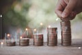 Saving money, educational, investment and financial concept for Stacking coins with hand of child putting money on top Royalty Free Stock Photo