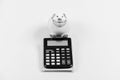 Saving money. First salary. piggy bank with calculator. Moneybox. business start up. Working with numbers. bookkeeping Royalty Free Stock Photo