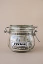 Saving Money In Glass Jar filled with Dollars banknotes. PENSION transcription in front of jar. Managing personal Royalty Free Stock Photo